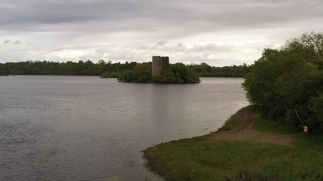 Establishing aerial dolly shot of Cloughoughter Castle in slow motion, County Cavan Ireland