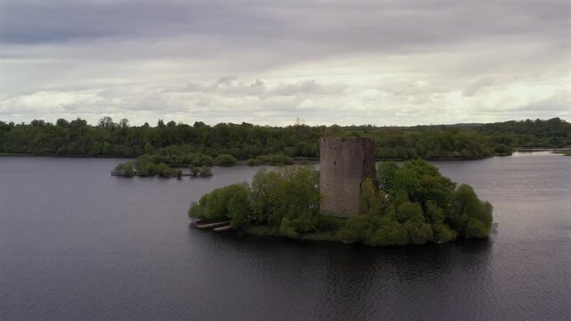 Slow motion aerial trucking shot of Cloughoughter Castle, County Cavan Ireland