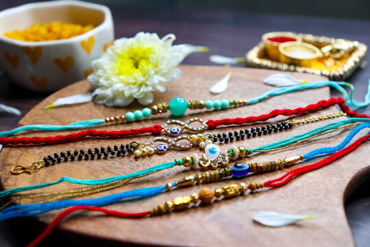 Indian festival Raksha bandhan. Rakhi thali with diya, flowers and tilak with sweet boondi or bundi. Puja thali for rakhi festival with roli chawal. copy space. also known as Narali Purnima. 