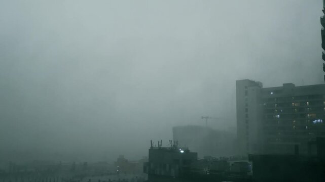 Heavy rain storm over city skyline. Monsoon weather hitting Delhi NCR urban buildings.