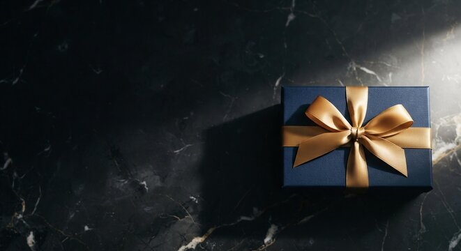 Elegant Navy Gift Box with Gold Ribbon on Black Marble, Luxury Holiday Shopping Background for Marketing