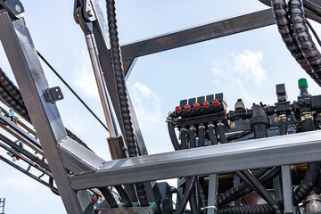 Agricultural sprayer section control valve manifold block. Modern farm machinery liquid distribution mechanism with hydraulic boom cylinder and equipment transport technical details view. © NastyaPhoto