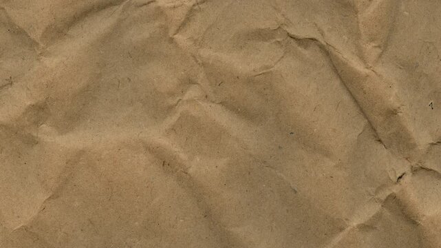 Crumpled paper shifting and unfolding in an artistic loop. Stop-motion wrinkled parchment texture overlay with organic rustic video aesthetics  Apple prores 422, 4k, stopmotion