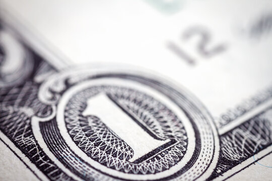 Macro close up of United States one dollar bill. American dollar background. Detailed dollars money texture. Selective focus, shallow depth of field
