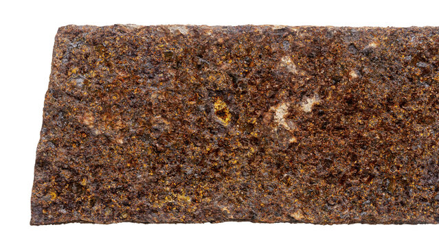 Part of old unknown rusty object isolated on white background. The usual metal detecting find.