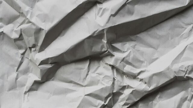 Paper crumpled background animation loop with blue lines and red margin. Stop-motion textured notebook effect with seamless wrinkled transitions  Apple prores 422, 4k, stopmotion