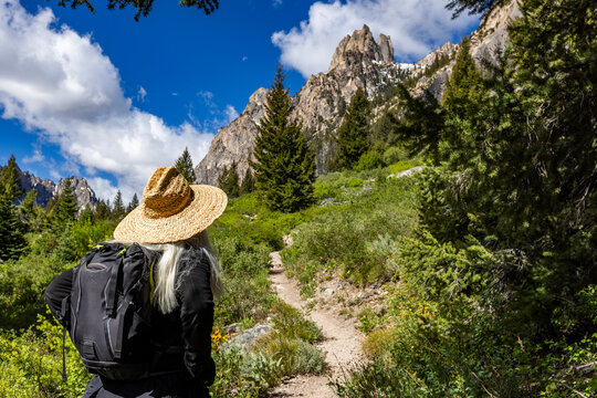 Rear view of senior woman hiking in Sawtooth Mountains