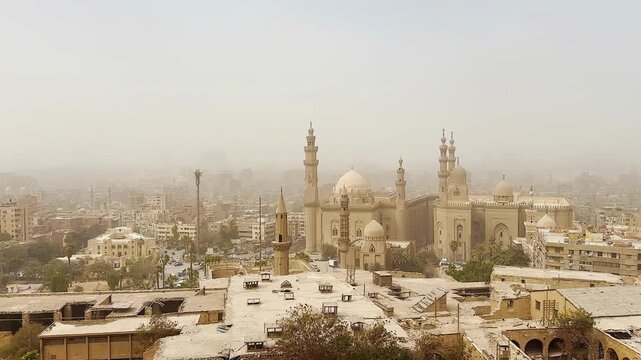 Dust storm in central Cairo. Sultan Hassan Mosque, Al-Rifai Mosque in Cairo, Egypt