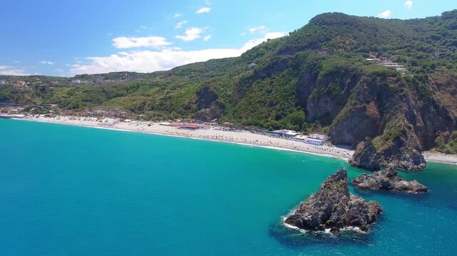 Ulivarella Beach and Ulivo Rock aerial view in slow motion, Calabria, Italy
