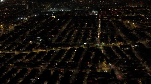 Streets, houses and buildings at night, with the lights on in the commune of Maipu, country of Chile