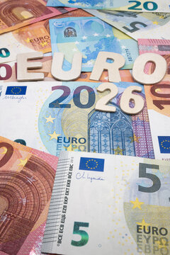 Euro currency, banknotes, and the inscription "Year 2026".
