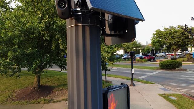 Flock safety police law enforcement license plate reader set up outside to help monitor traffic and catch vehicle speeders.