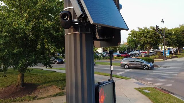 Flock safety police law enforcement license plate reader set up outside to help monitor traffic and catch vehicle speeders.