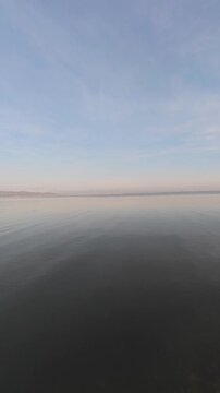 Calm Water Reflecting Sky