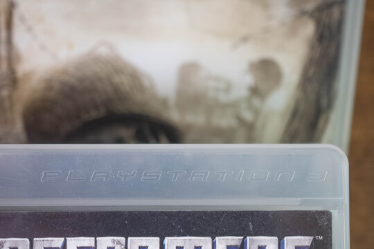 Playstation 3 Sony  logo on used playstation game box, copy space background image physical game, market collectors, second hand