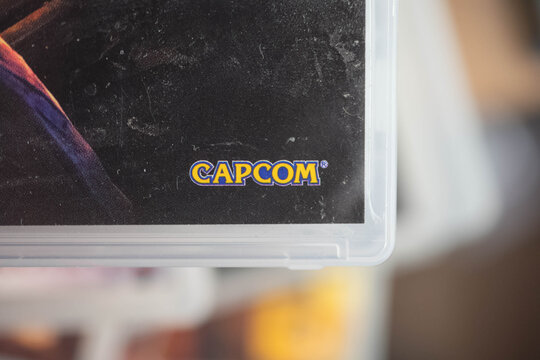 Capcom game developer logo on used playstation game box, copy space background image physical game, market collectors, second hand
