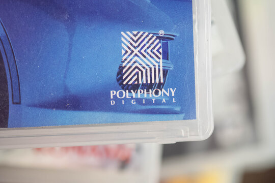 Polyphony game developer logo on used playstation game box, copy space background image physical game, market collectors, second hand