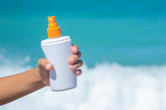 Sunscreen Spray Bottle in Childs Hand