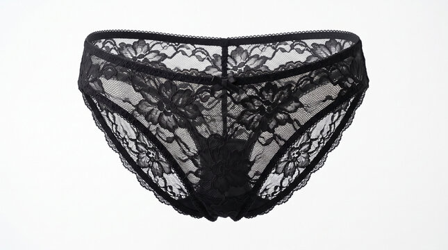 Black lace panties bikini cut style on white background. Delicate black lace panties bikini cut style features floral pattern, sheer fabric, comfortable design.