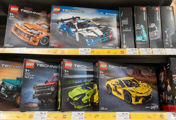 Fototapeta premium Lego products on a shelf in a shop. Boxes of Lego sets displayed on supermarket shelves. Minsk, Belarus - June 10, 2026