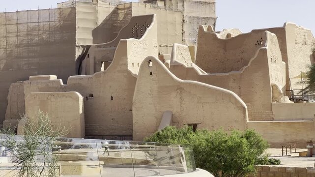 DIRIYAH, SAUDI ARABIA - JULY 10, 2026: Historic At-Turaif district showcasing traditional mud-brick Najdi architecture and palm trees in Diriyah.