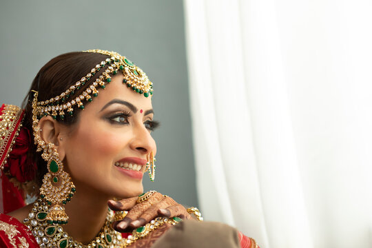Indian bride looking out of window