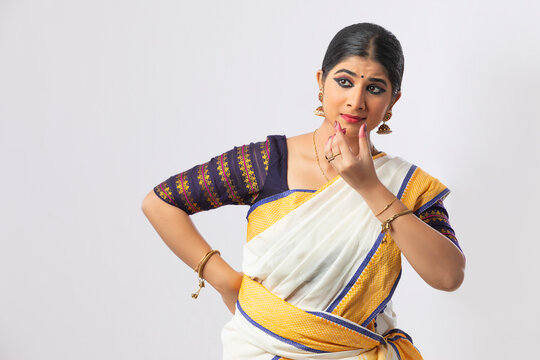 Mohiniattam dancer requesting a person to speak through her dance