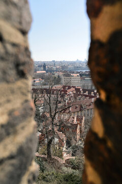 Prague cityscape seen through a gap between walls