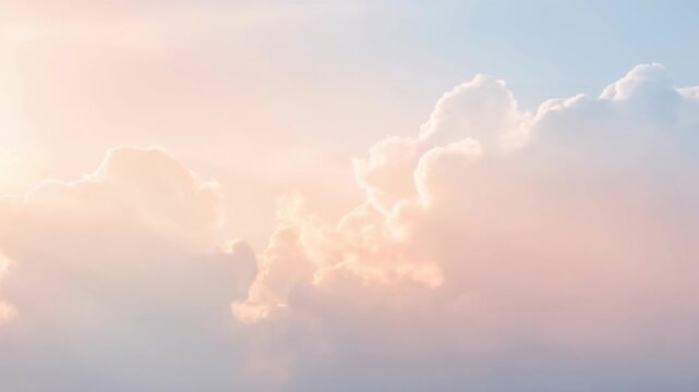 Soft pastel sky with fluffy clouds during a serene sunrise or sunset