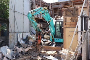 Bulldozer Demolishing Old Building at Construction Site in Japan © Андрий Мищак