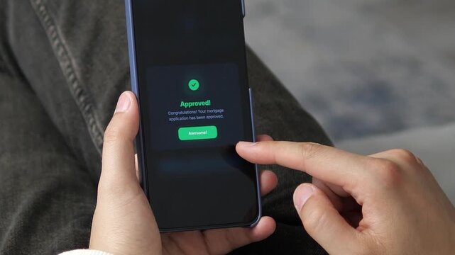 Mortgage approval appears on a smartphone, capturing the rise of instant digital lending, automated decisions and mobile access to home financing.
