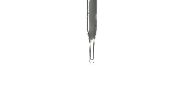 Closeup shot of scientist dripping liquid on white background.
