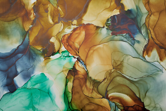 Currents of translucent hues, snaking metallic swirls, and foamy sprays of color shape the landscape of these free-flowing textures. Natural luxury abstract fluid art painting in liquid ink technique