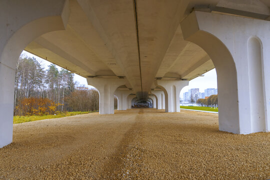 Minimalist urban bridge. Elegant urban bridge showcasing repeating columns and subtle illumination