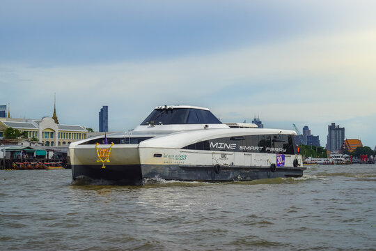 Bangkok, Thailand - June  16, 2026 : Electric passenger boats operating on the Chao Phraya River during the daytime.