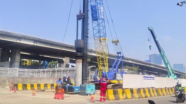 Pile Driving Machine Installing Concrete Foundation for Flyover Construction Project
