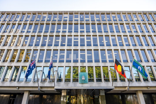 Office building with Australian flags at Treasury Place, Melbourne, Australia. Government office complex serves as the Office of the Premier of Victoria and other integral government deparments