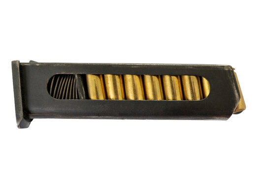 Metallic handgun magazine filled with brass bullets showing internal spring and ammunition rounds through inspection slot is isolated on transparent background.
