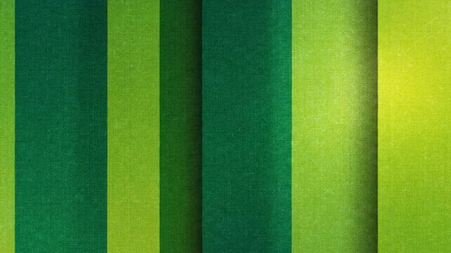 Seamless looping abstract vertical stripes with variations of green and yellow colors for background or wallpaper.