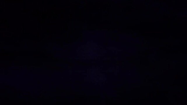Abstract mirrored stormy night sky with blue atmospheric light flashes