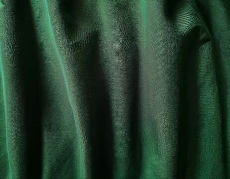 deep green textured linen fabric backdrop with a soft wrinkled surface ideal for backgrounds and textile design perfect for artistic applications