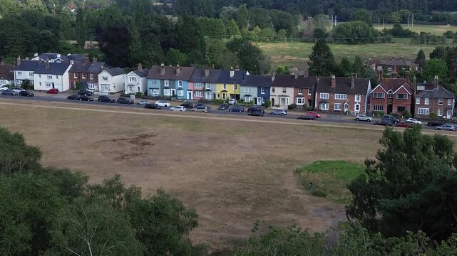 REIGATE, SURREY - UK:- Colourful terraced houses overlooking Reigate Heath.  Aesthetic old cottages in rural England, in the London commuter belt. 