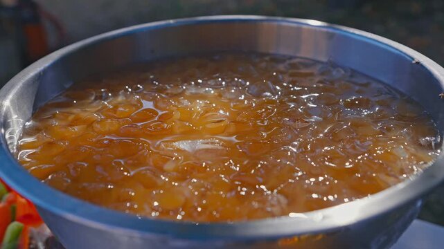 Close Up of Iced Fruit Punch in Stainless Steel Beverage Bowl