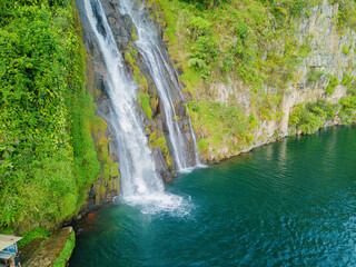 Aerial drone view of greenery hills with Situmurun Waterfall near Toba Lake at Lumban Juju in Toba, Sumatera Utara, Indonesia © MUAZ JAFFAR