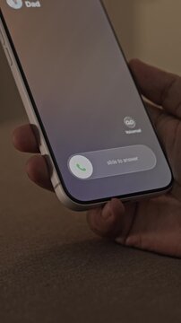 Person Receiving and Answering an Incoming Call on a Smartphone.