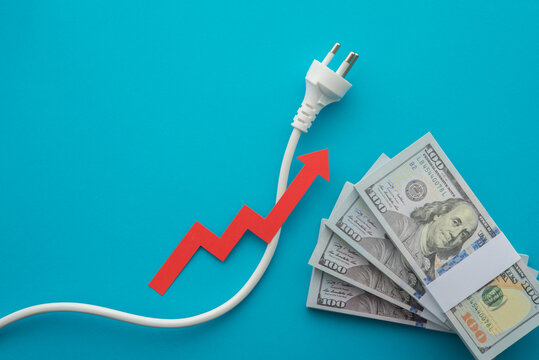 US bill banknotes, electrical plug with growth red chart on blue background. Electricity prices increase, energy crisis in war, home financial management and planning, expense control concept.