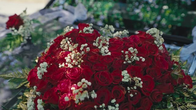 Close Up of Red Rose Wedding Car Decoration with Baby's Breath