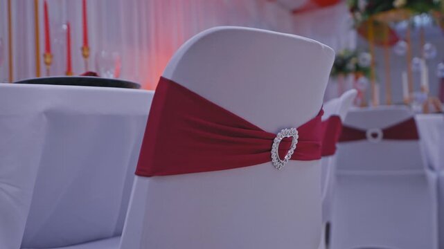 Elegant Wedding Reception Chair with Red Satin Sash and Heart Buckle