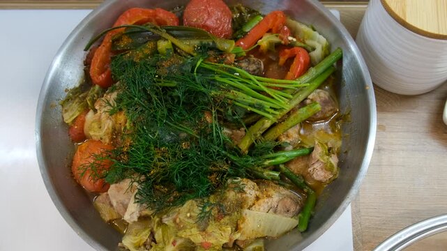 A dish of stewed vegetables in a frying pan. Selective focus.