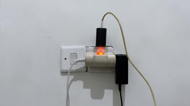 electric plug and socket on the wall